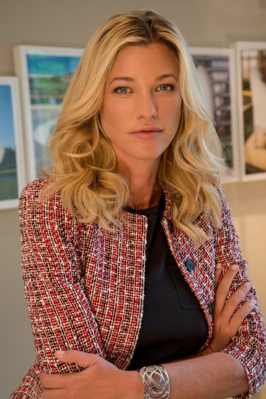 Nicole Junkermann in a considered portrait among framed pictures, reflecting on art in the age of AI and why the human touch still matters
