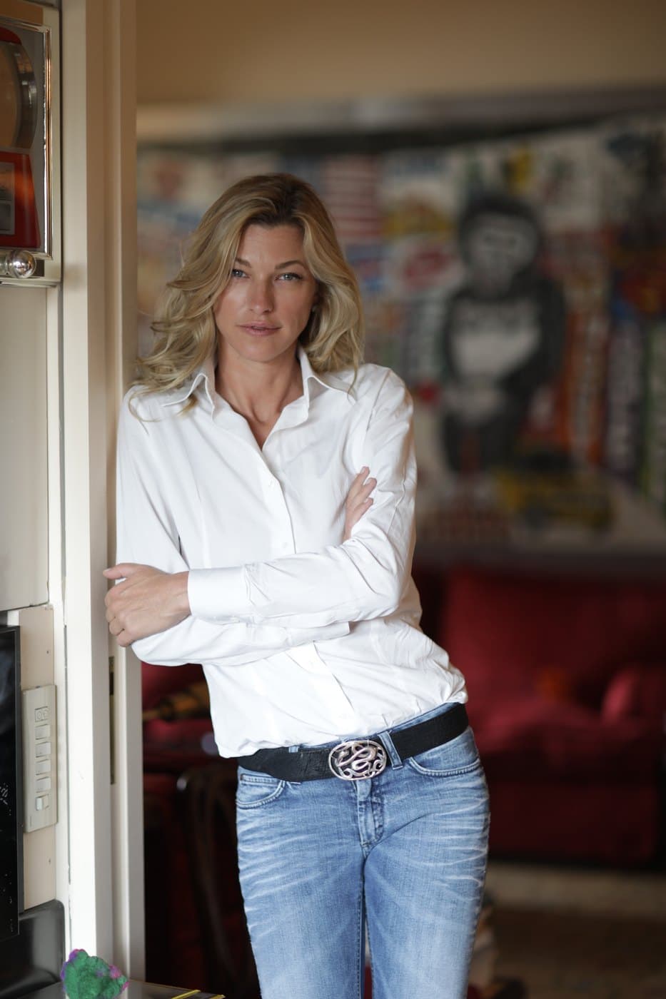 Nicole Junkermann standing in a bright doorway, a relaxed portrait